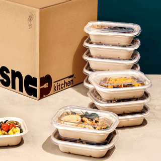 snap kitchen meals stacked with box-prepared meal delivery-mealfinds