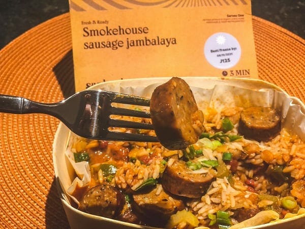 sausage jambalaya in bowl with sausage on fork-sunbasket reviews-mealfinds