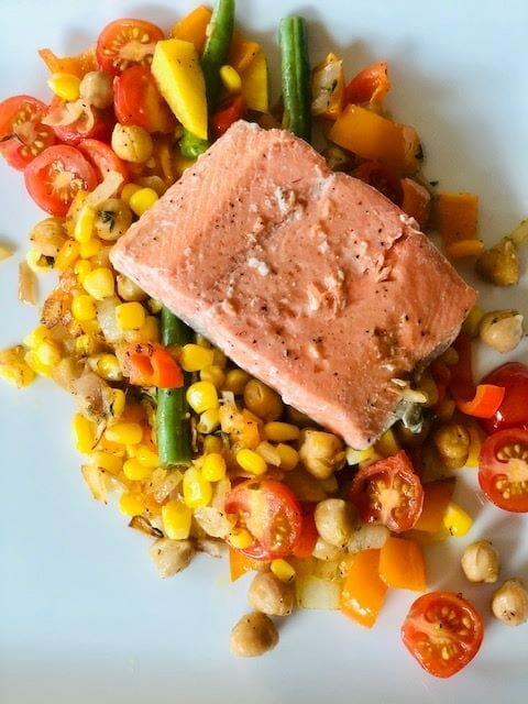ikarian-summer-succotash-with-salmon on plate- nutrition for longevity reviews-mealfinds