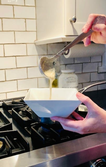 spoonful-of-comfort-chowder being poured into bowl- spoonful of comfort reviews-mealfinds