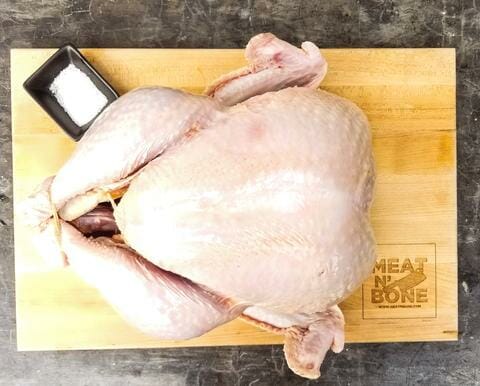 thanksgiving turkey by meat n bone raw on cutting board-thanksgiving turkey delivered-mealfinds