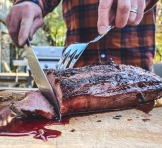slicing chateaubriand on cutting board-crowd cow review-mealfinds