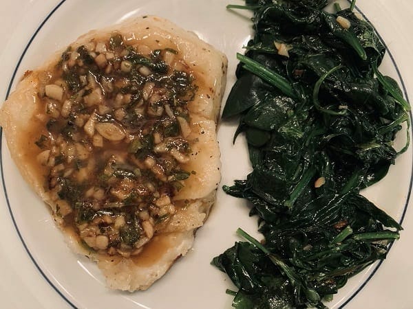 chilean sea bass cooked on plate with spinach-Meat N Bone reviews-mealfinds