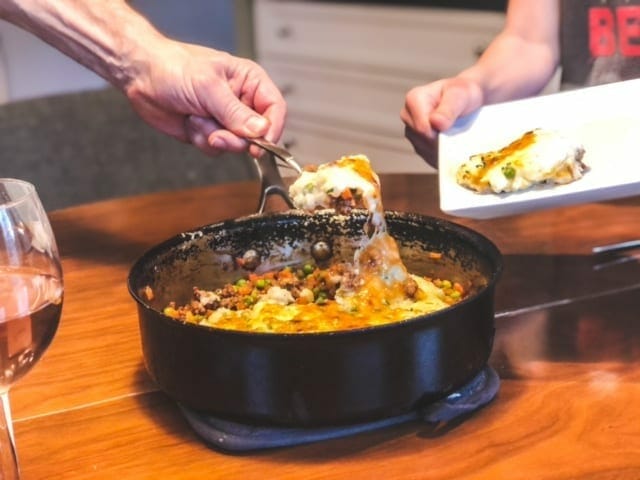shepards pie in pan being spooned onto plate-green chef reviews-mealfinds