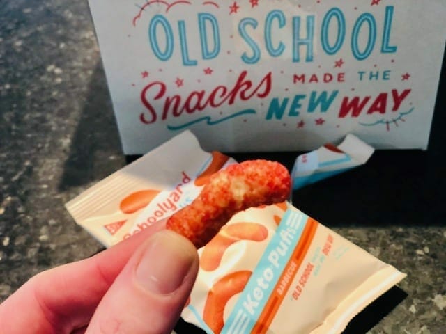 schoolyard-snacks-keto-bbq-puff in finger- schoolyard snacks reviews-mealfinds
