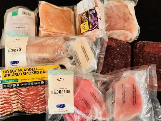 meat and seafood on counter-thrive market reviews-mealfinds