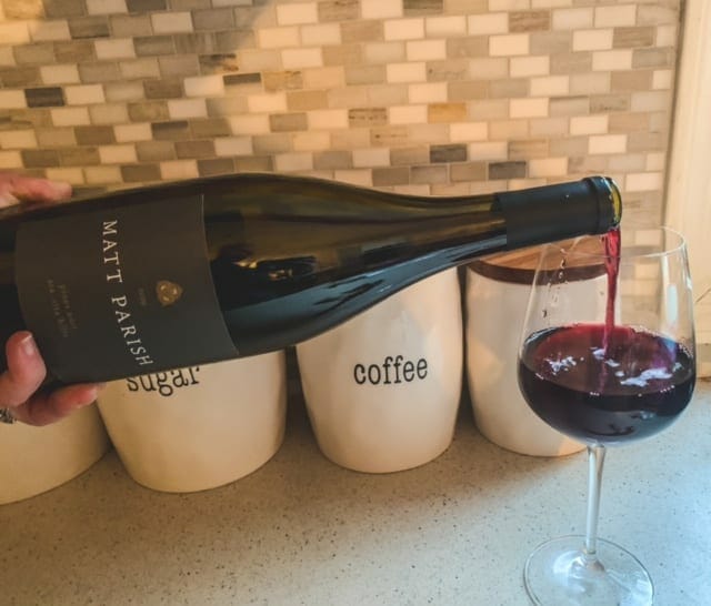 pouring matt parish wine into glass-naked wines reviews-mealfinds