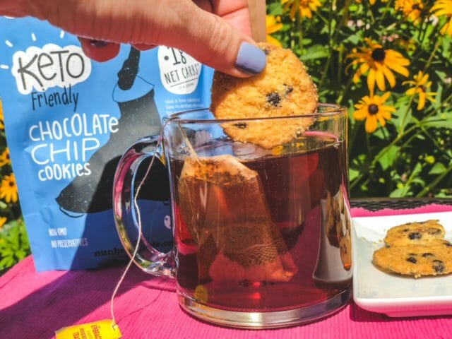 dipping cookie into tea-nunbelievable cookies reviews-mealfinds