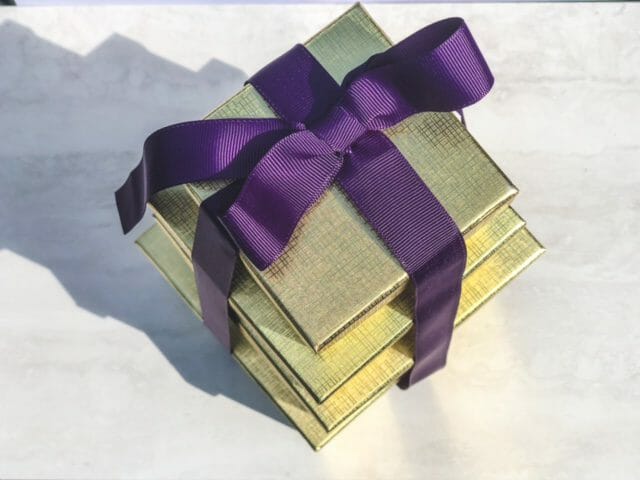 gold gift box tower with purple ribbon-bake me a wish reviews-mealfinds