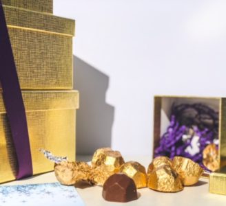 chocolate truffles in gold foil spilling out of gift box-bake me a wish reviews-mealfinds