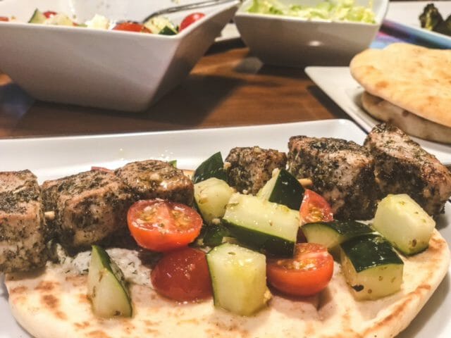 chicken souvlaki with tomato and cucumber on plate--eat2explore cooking kit reviews-mealfinds