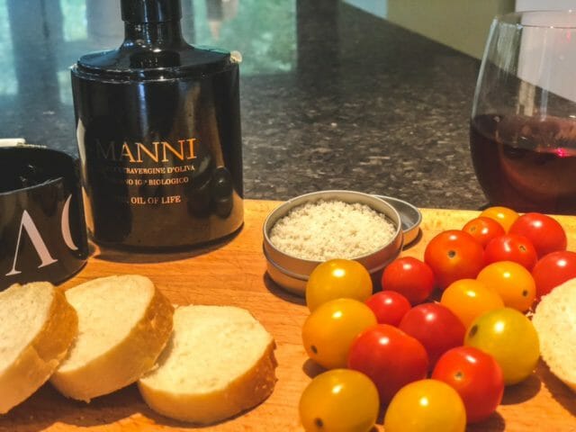 cutting board bread olive oil sea salt tomoato-manni best olive oil revews-mealfinds