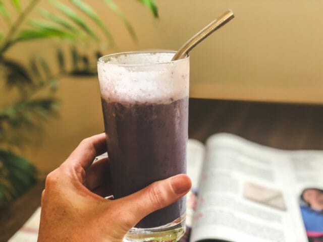 metamorphosis smoothie in glass above magazine-bumpin blends smoothies reviews-mealfinds