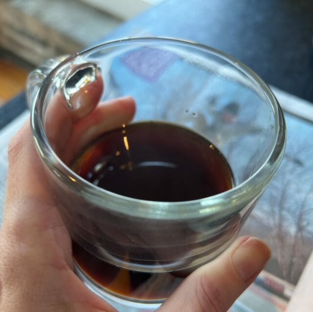 black coffee in coffee cup over newspaper-real good coffee co review-mealfinds