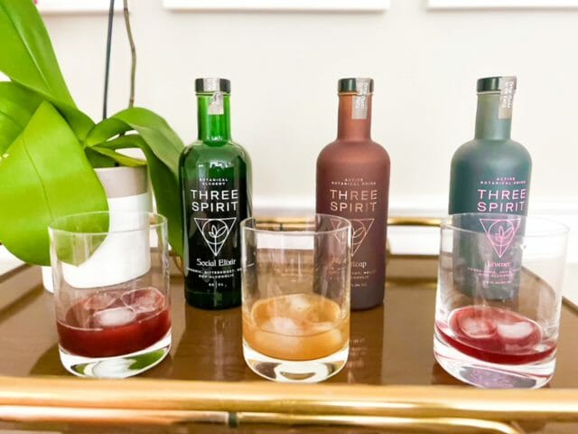 three spirit taste test glasses on bar cart-three spirit drinks review-mealfinds