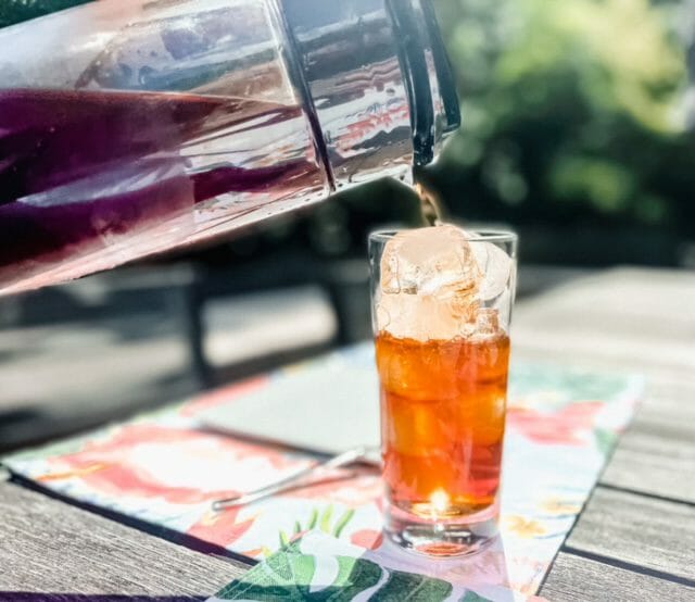 pouring cold brew coffee into glasstrade coffee reviews-mealfinds