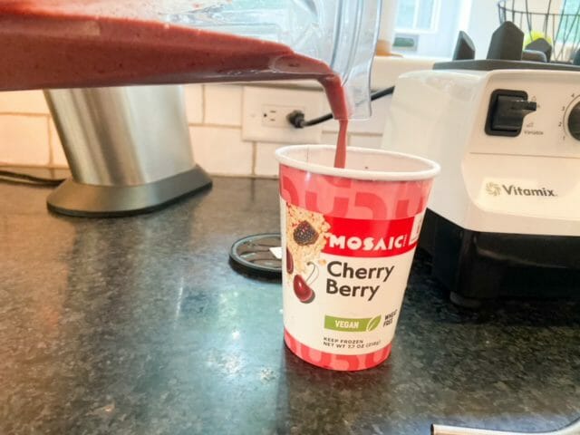 pouring smoothie in cup-mosaic foods smoothies review-mealfinds