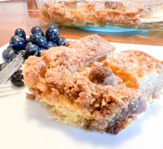 french toast on plate with blueberries-sourdough bread french toast casserole recipe-mealfinds