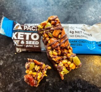 dark chocolate pretzel keto granola bar eating -munk pack keto granola bar review-mealfinds