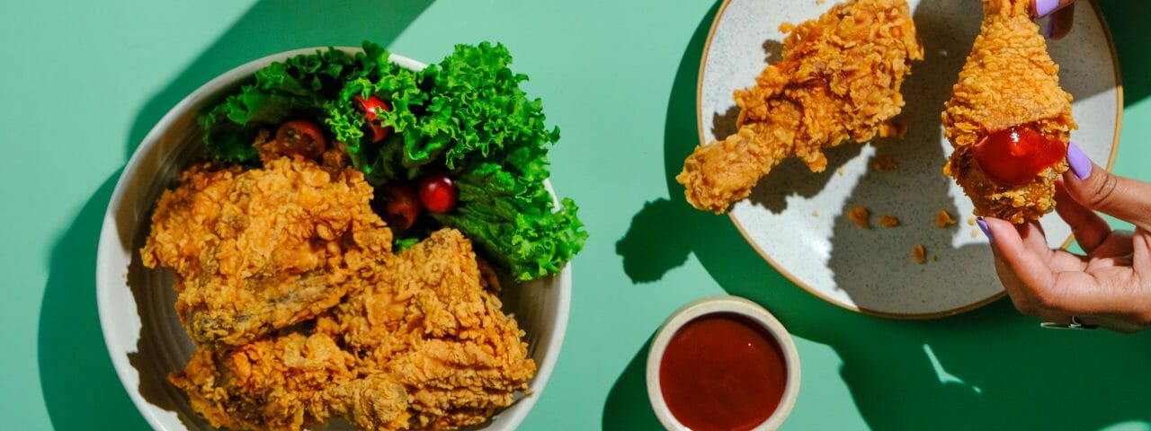 eating fried chicken-homepage hero-mealfinds