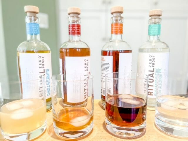 ritual zero proof tasting with bottles and glasses-ritual zero proof review-mealfinds